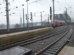 Einfahrt eines Talent 2 und der RB 25 in Kln HBF.