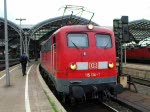 115 114-1 verlsst mit einem Schadwagenzug den klner HBf