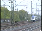 Einfahrt eines Metronom und einem Autozug mit einer 115 am 14.5 in Hamburg-Harburg.